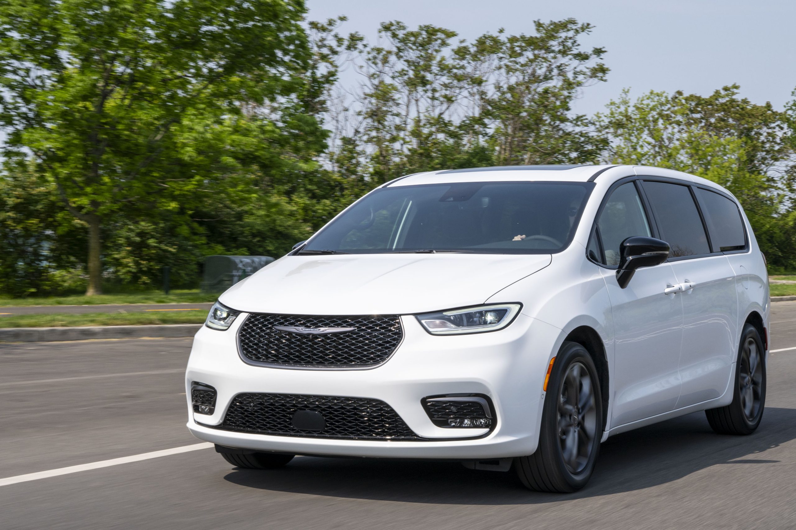 White 2026 Chrysler Pacifica on the road.