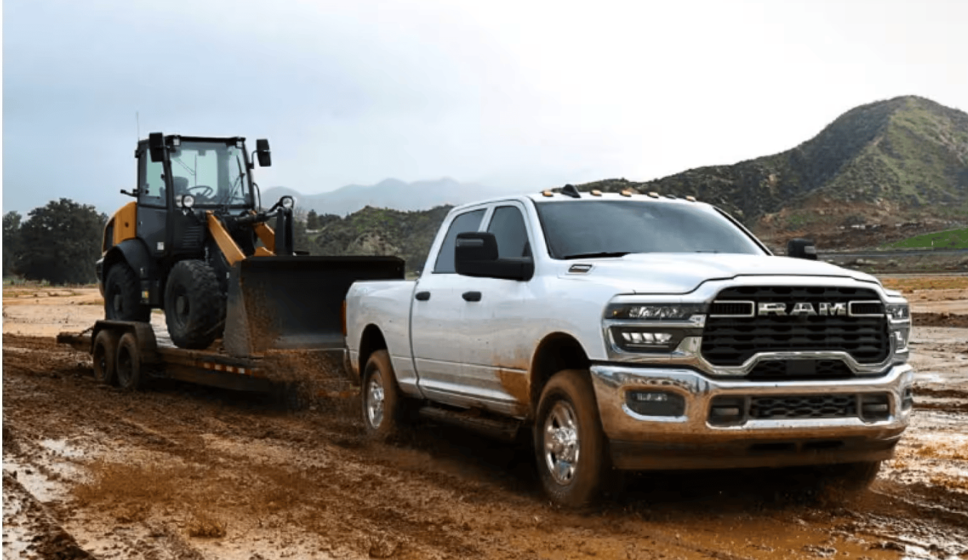 2026 RAM 2500 towing a small bulldozer